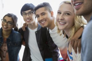 Portrait smiling college students bonding
